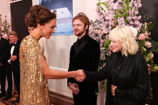 Catherine, Duchess of Cambridge meets the "No Time To Die" Performers Finneas and Billie Eilish at the "No Time To Die" World Premiere at the Royal Albert Hall on September 28, 2021 in London, England.