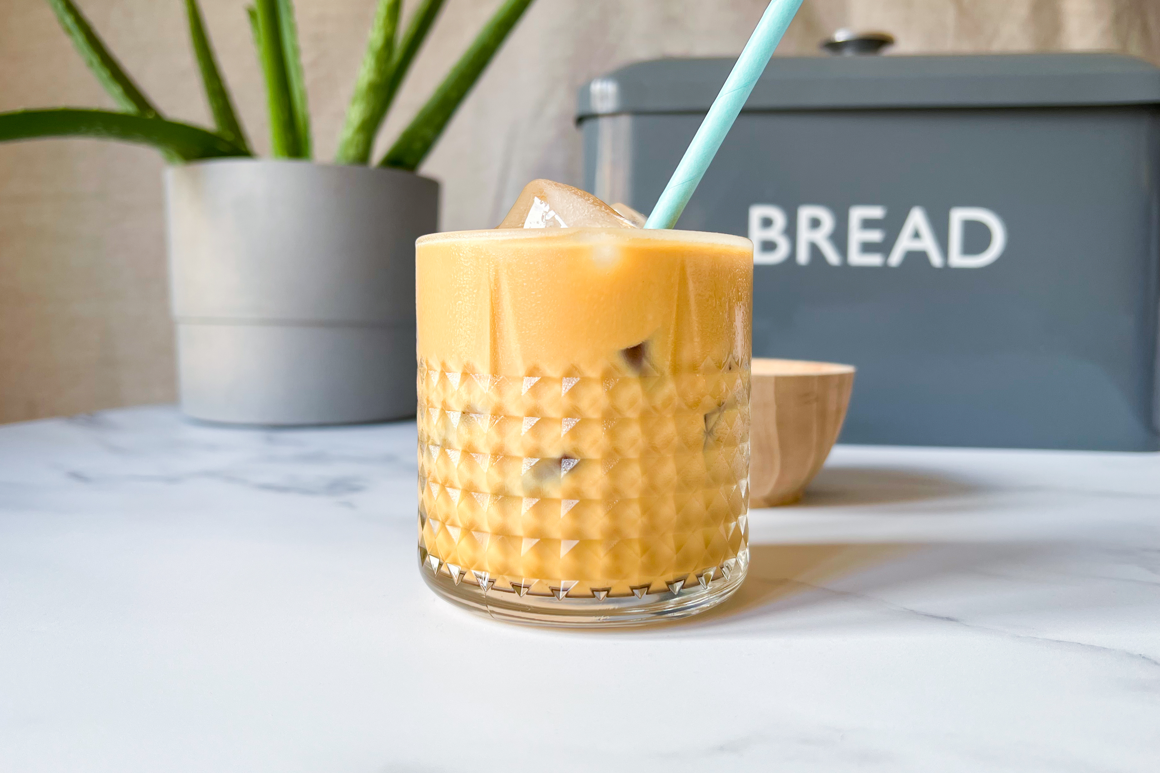 An iced coffee on a worktop