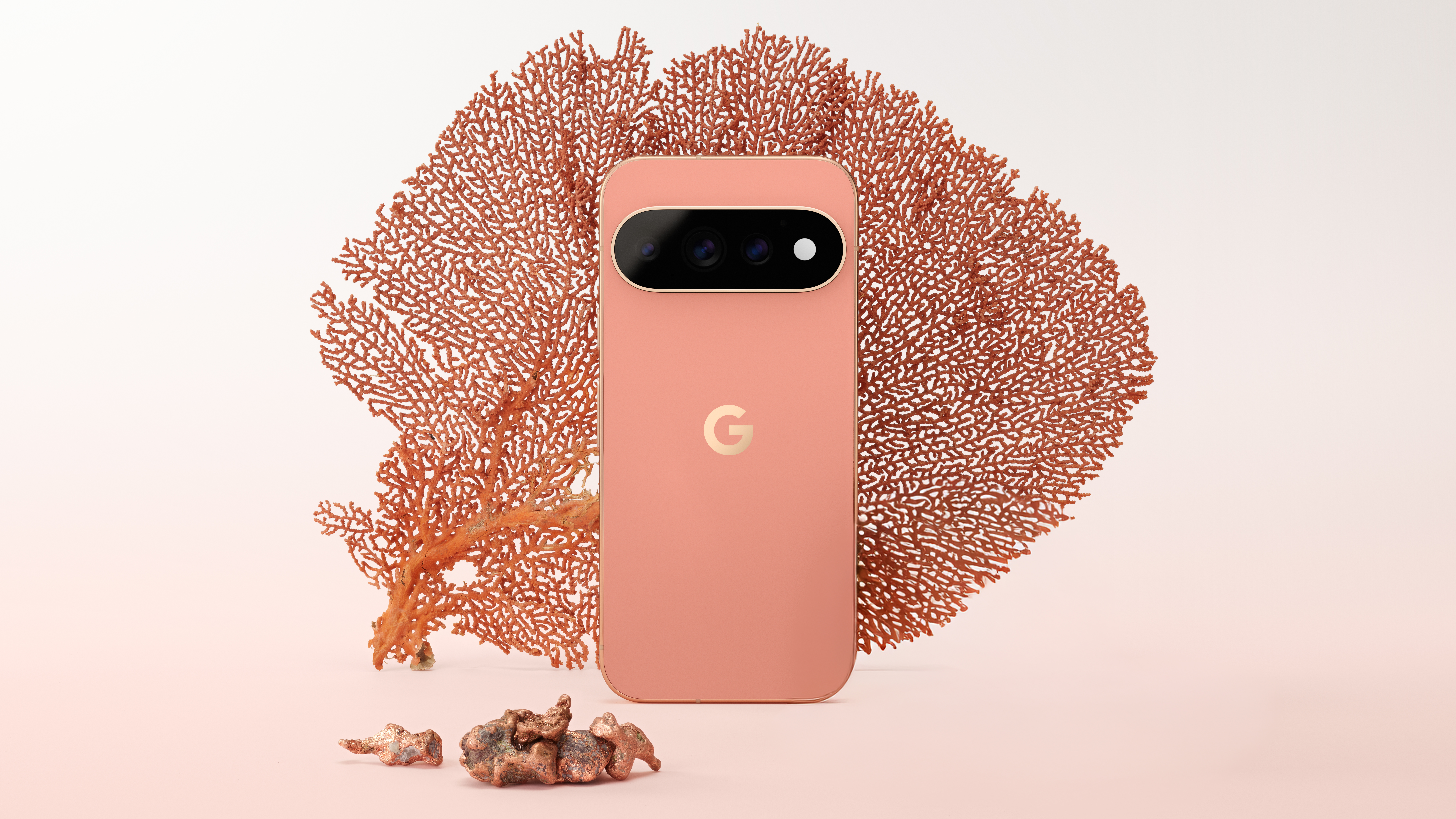 Google Pixel 11 Pro in front of a sheet of coral