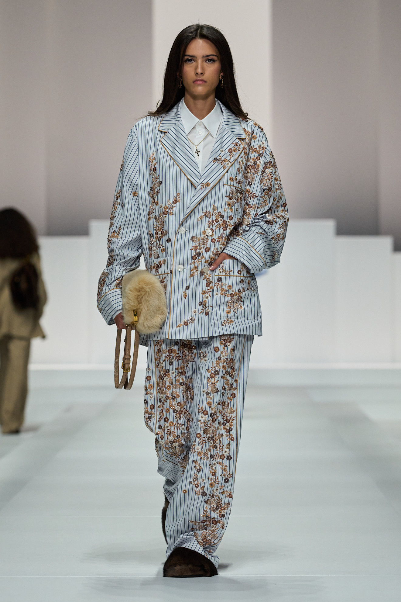 A model on dolce &amp;amp; Gabbana runway wears a pajama-inspired outfit with flroals.