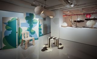 An exhibition featuring a multi-coloured chair and a black and white mini-table, in R & Company’s new New York gallery space