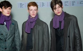 Male models wearing grey coats and purple scarves from Hermes AW15 collection