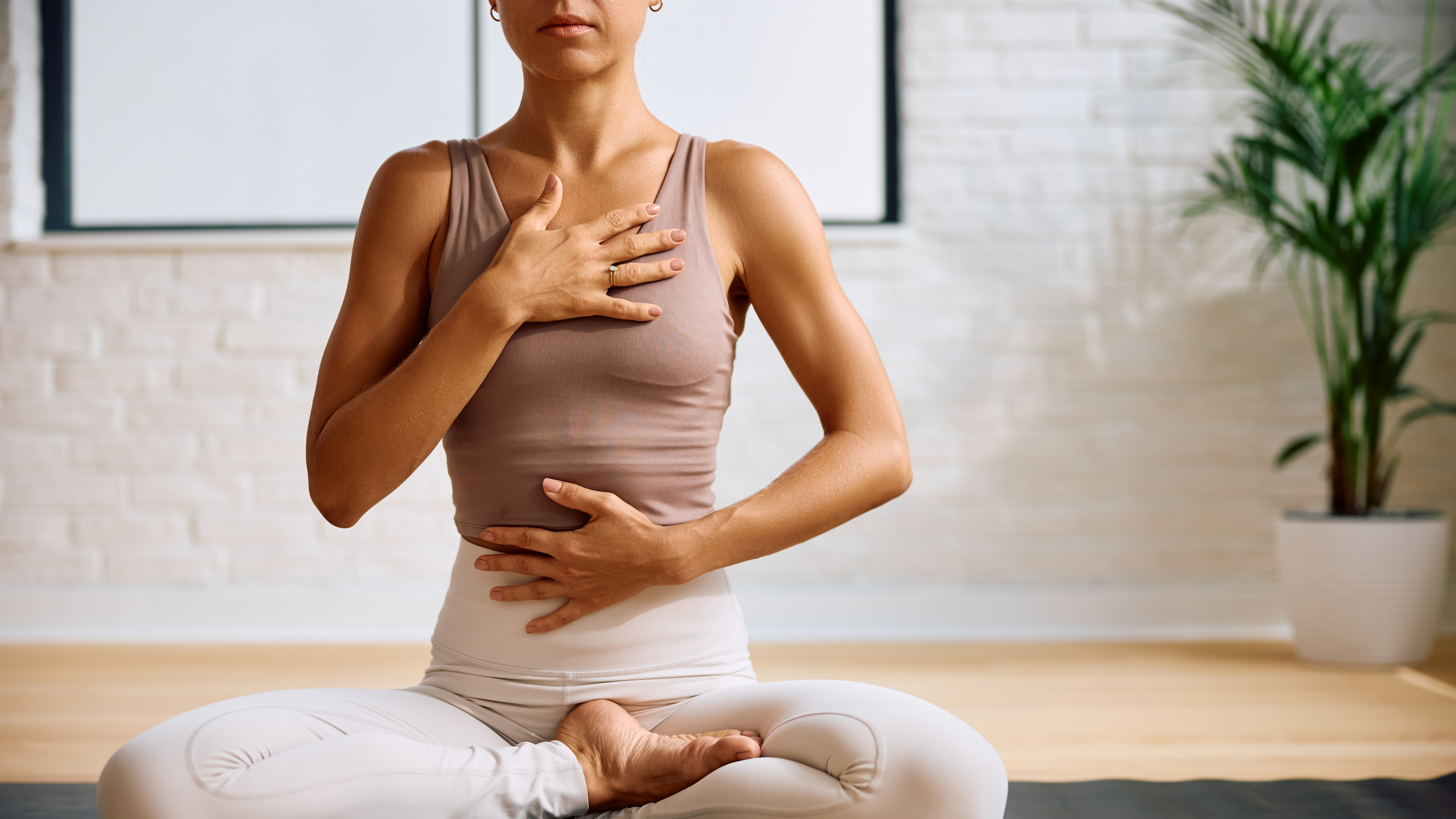 a woman meditating on a mat