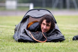 Australian cyclist Lachlan Morton sets up his bivouac at the end of the 13th day of his solo alternative Tour de France