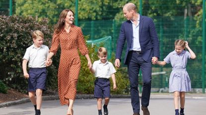 Prince George, Princess Charlotte and Prince Louis (C), accompanied by their parents the Prince William, Duke of Cambridge and Catherine, Duchess of Cambridge, arrive for a settling in afternoon at Lambrook School, near Ascot on September 7, 2022 in Bracknell, England. 