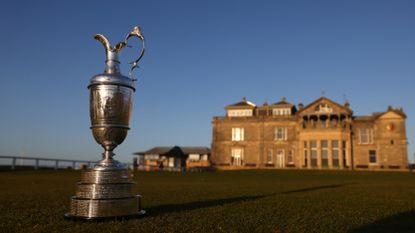 The Claret Jug sitting on the Old Course in St Andrews