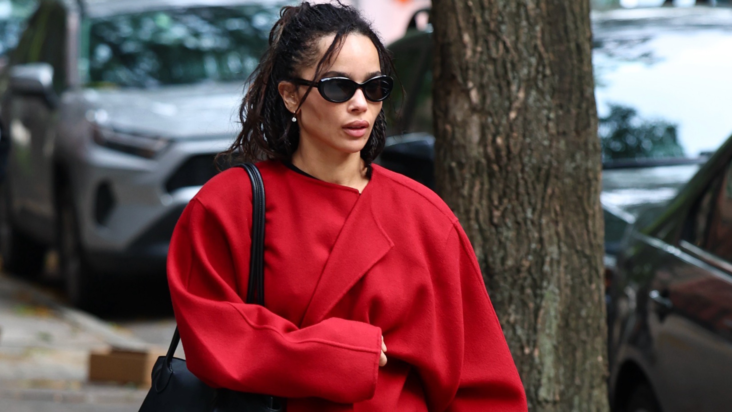 Zo&euml; Kravitz wearing a red coat.
