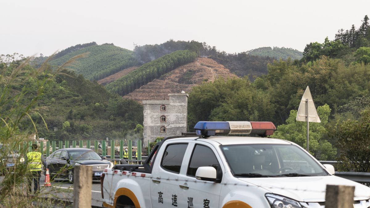 Rescuers work at the site of the plane crash of China Eastern Airlines Flight MU5735 on March 21, 2022, in Tengxian County, Wuzhou City, China. The Boeing 737-800NG aircraft was carrying 132 people.