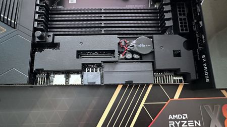 A photo showing an MSI MEG X870E Godlike X Edition motherboard, with its EZ Bridge system removed