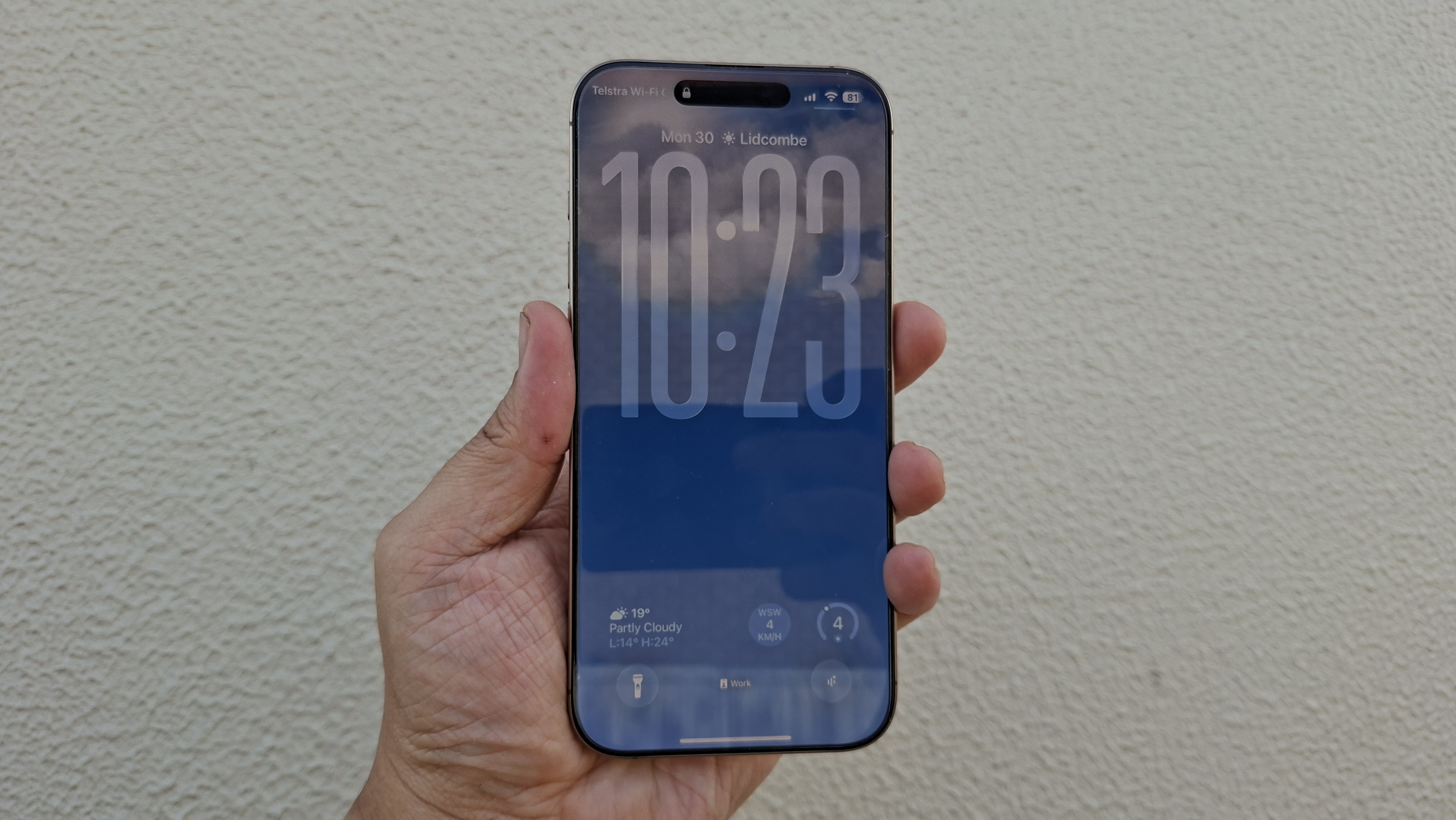 The iPhone 16 Pro Max on a concrete background