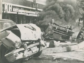 Black and white photograph of car crash scene