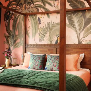 Bedroom with tropical mural wallpaper behind bedhead