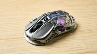 A gunmetal gray GravaStar Mercury M1 Pro wireless gaming mouse