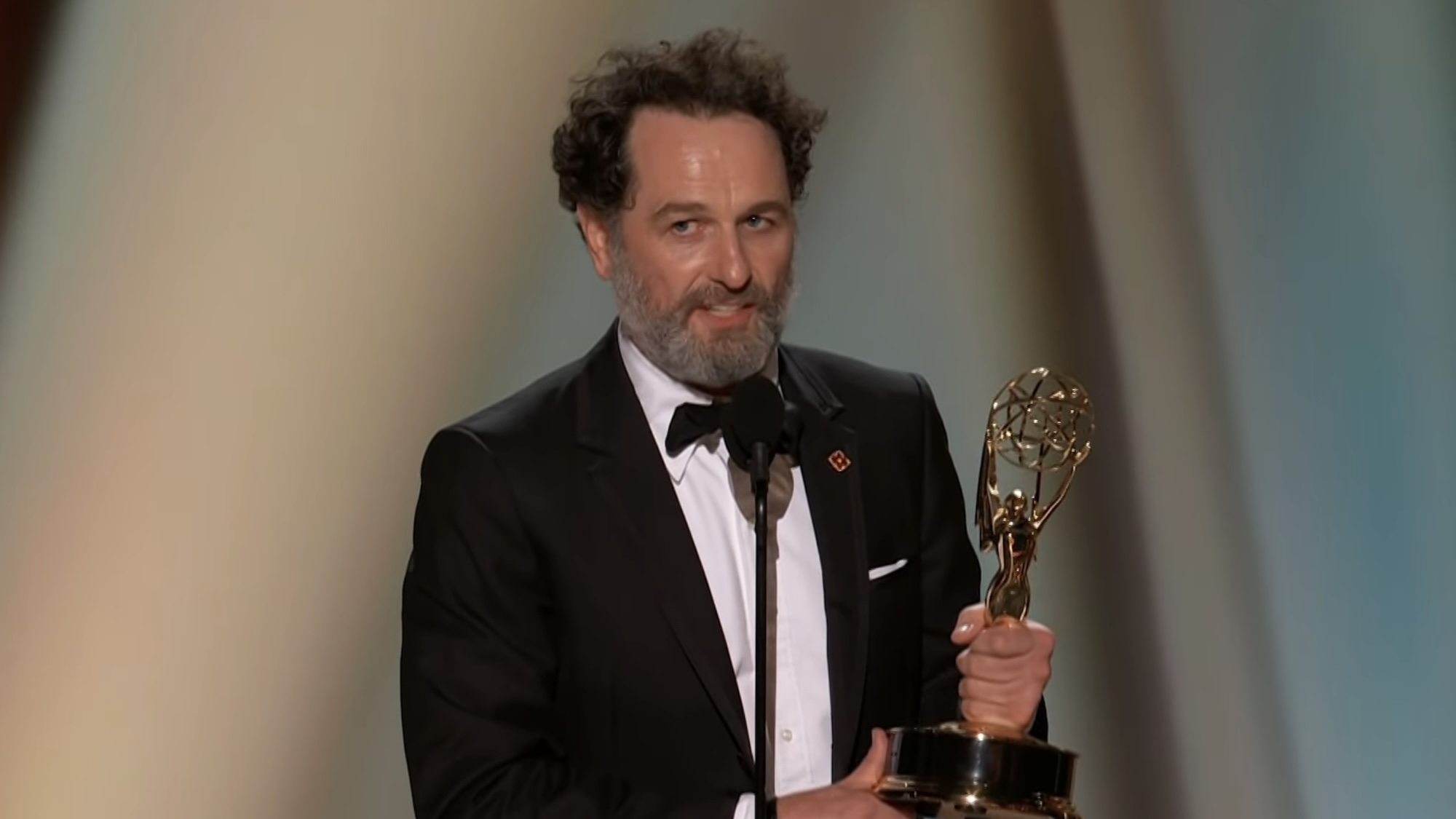 Matthew Rhys accepting award for Widow's Bay at 2026 emmys