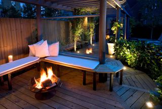 deck lighting with fire pit and bench