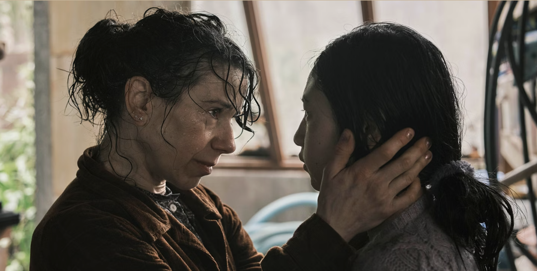 Sally Hawkins in Bring Her Back, holding the face of a young girl