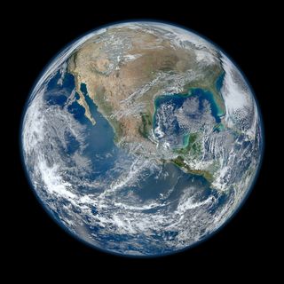 A 'Blue Marble' image of the Earth taken from the VIIRS instrument aboard NASA's most recently launched Earth-observing satellite - Suomi NPP. This composite image uses a number of swaths of the Earth's surface taken on Jan. 4, 2012.