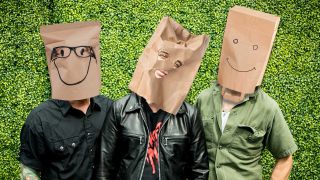A photoshop of Green Day with paper bags on their heads