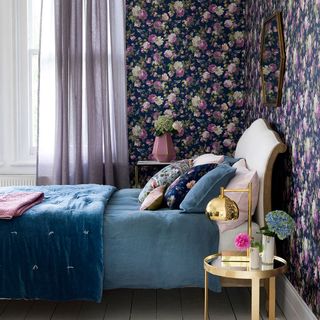 bedroom with purple floral wallpaper