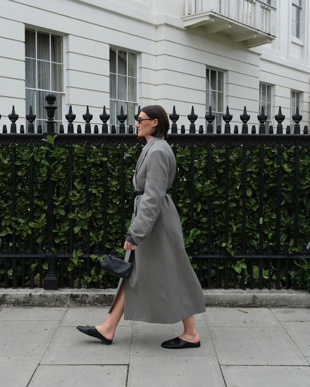 Sarah Louise Blythe wearing a grey The Frankie Shop coat