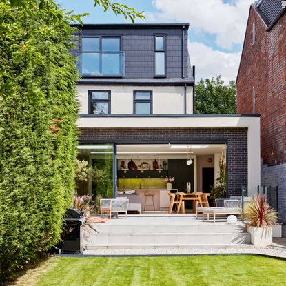 Exterior of house showing ground floor extension and loft conversion