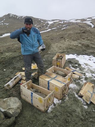 A researcher pauses to drink some mate during the excavation of the plesiosaur in Antarctica.