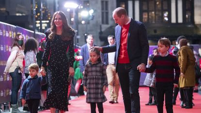 london, england december 11 prince william, duke of cambridge and catherine, duchess of cambridge with their children, prince louis, princess charlotte and prince george, attend a special pantomime performance at london's palladium theatre, hosted by the national lottery, to thank key workers and their families for 