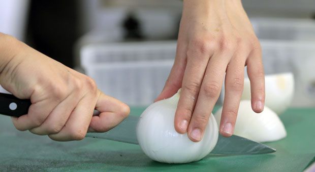 An onion being sliced