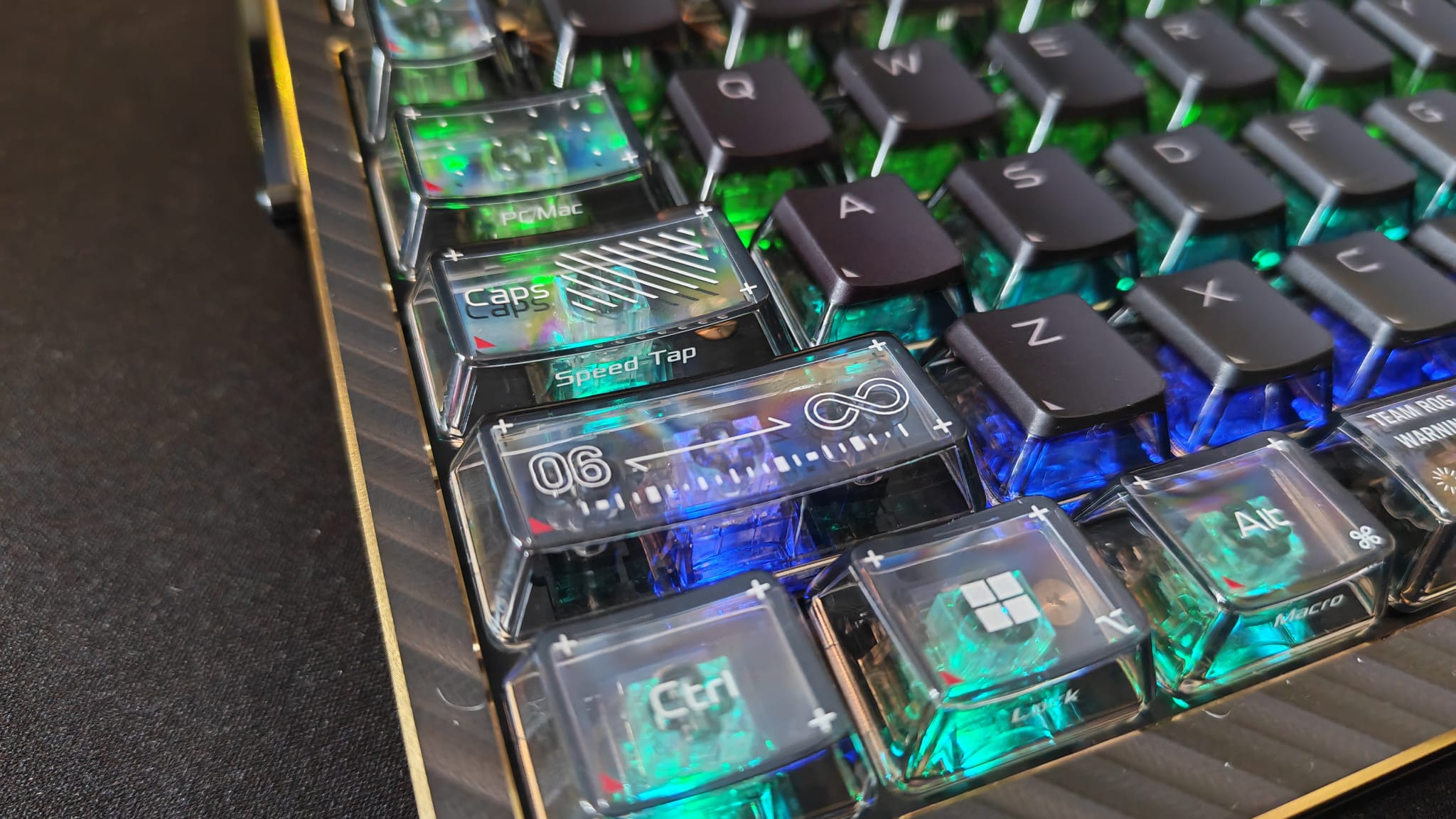 Some of the function keys with RGB lighting shining through them on the Asus ROG Azoth Extreme 20