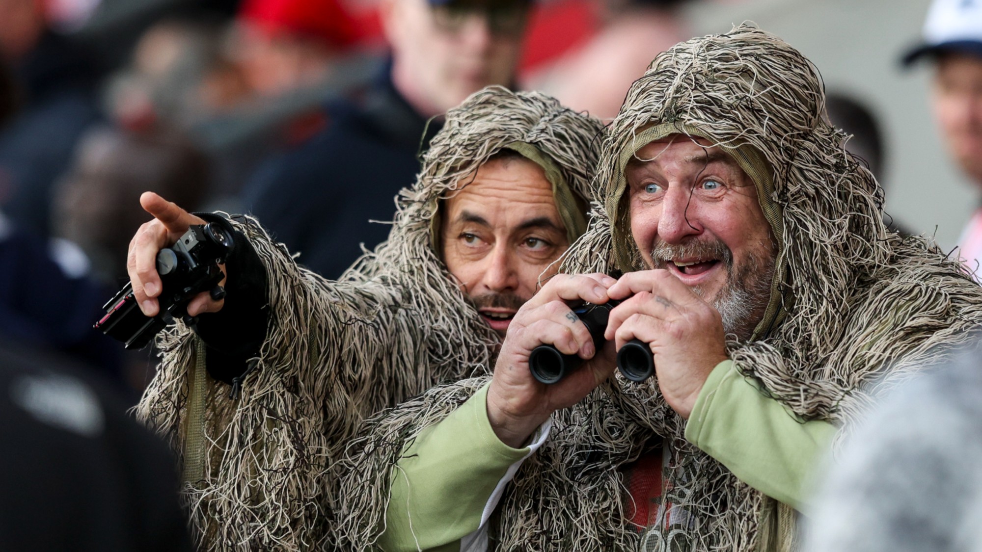Mocking Southampton fans in camouflage suits after their side was accused of spying on a Middlesbrough training session