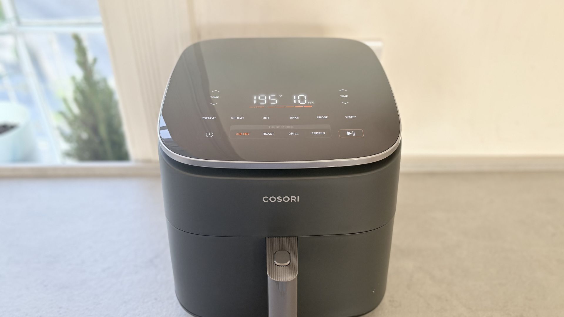 Testing the Cosori TurboBlaze 6L Air Fryer showing the controls