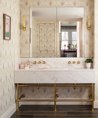 bathroom with patterned wallpaper and marble washstand