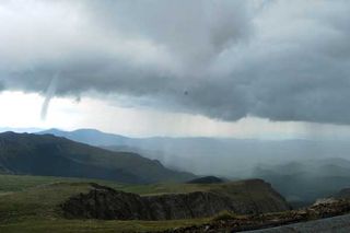 Meg MacDonald took this photo of a tornado about 3 PM on July 28, which touched down near Mount Evans, Colo., and is the second-highest recorded in US history. 
