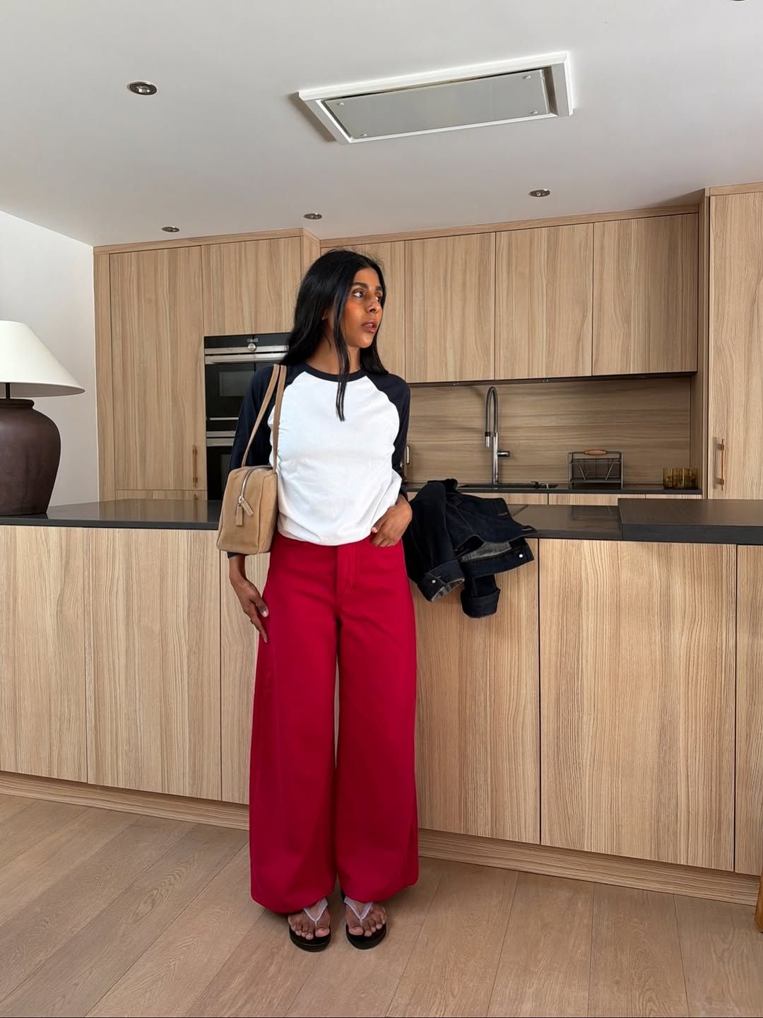 Monikh in red jeans