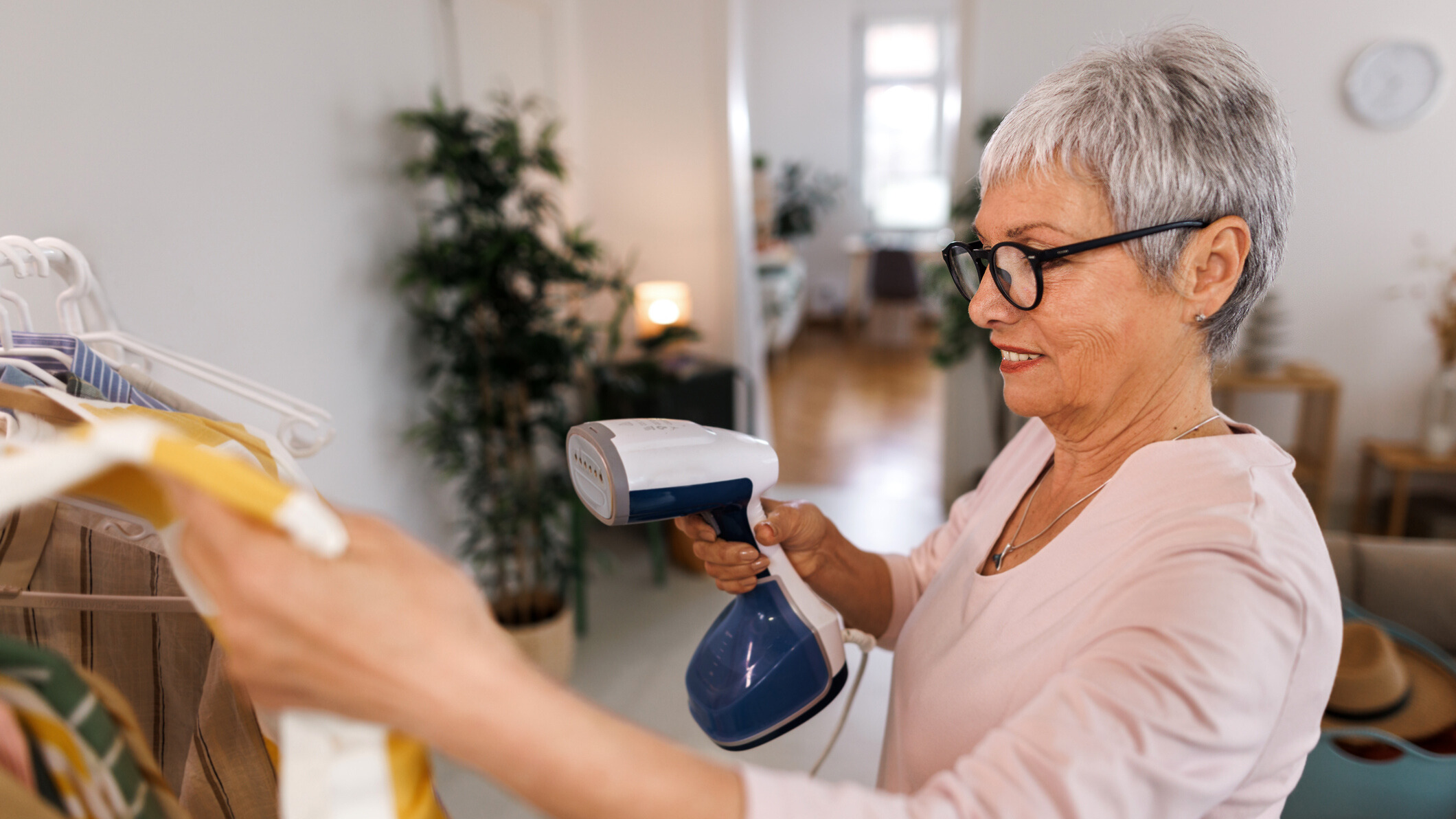Woman using a cloth steamer