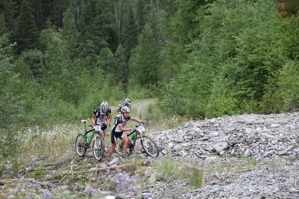 A pair make their way on foot on one of stage 5's steeper sections