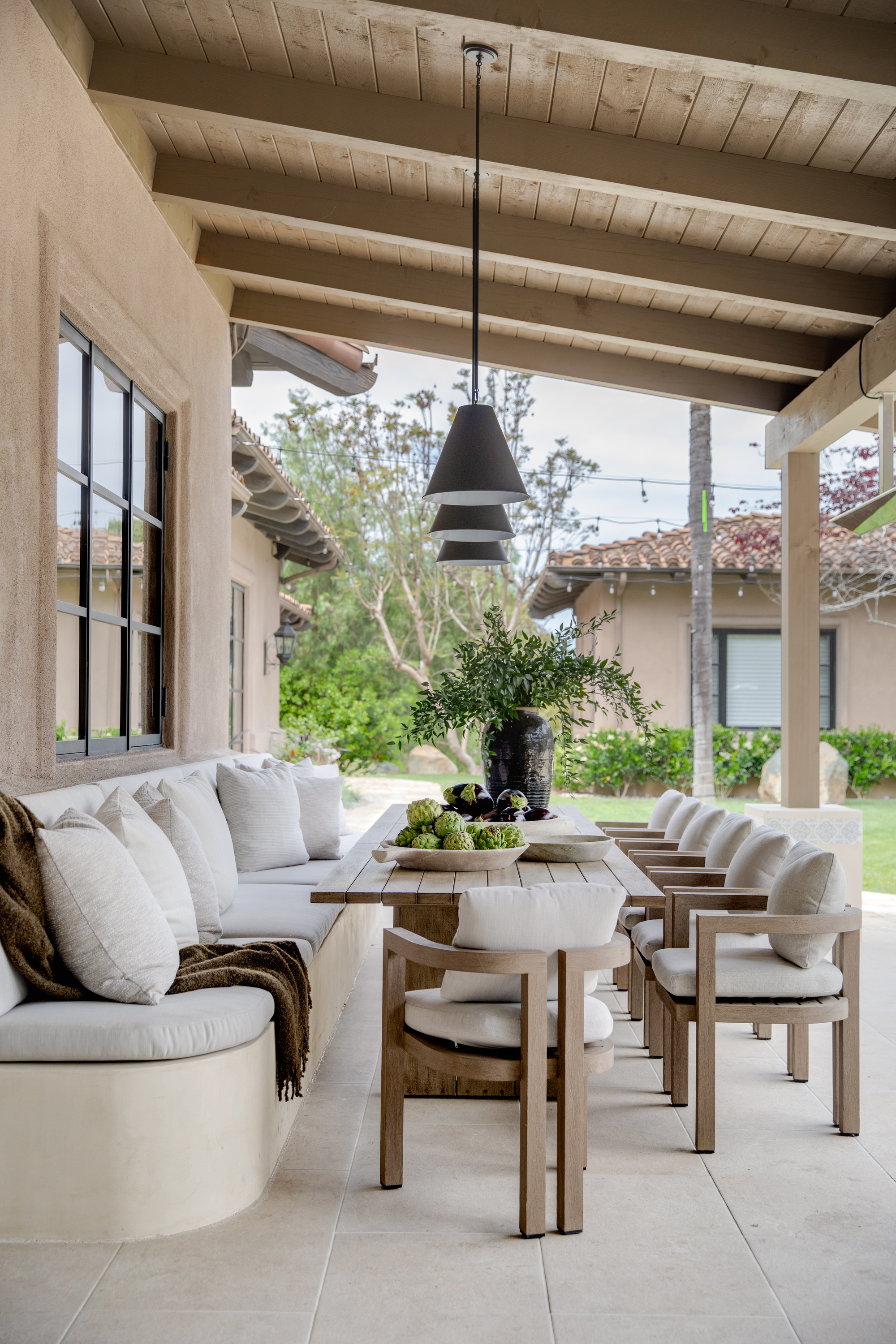 An outdoor dining area with overhead lighting