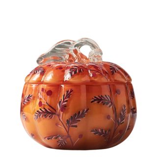 A glass Handpainted Pumpkin & Sweet Vanilla Glass Pumpkin Candle