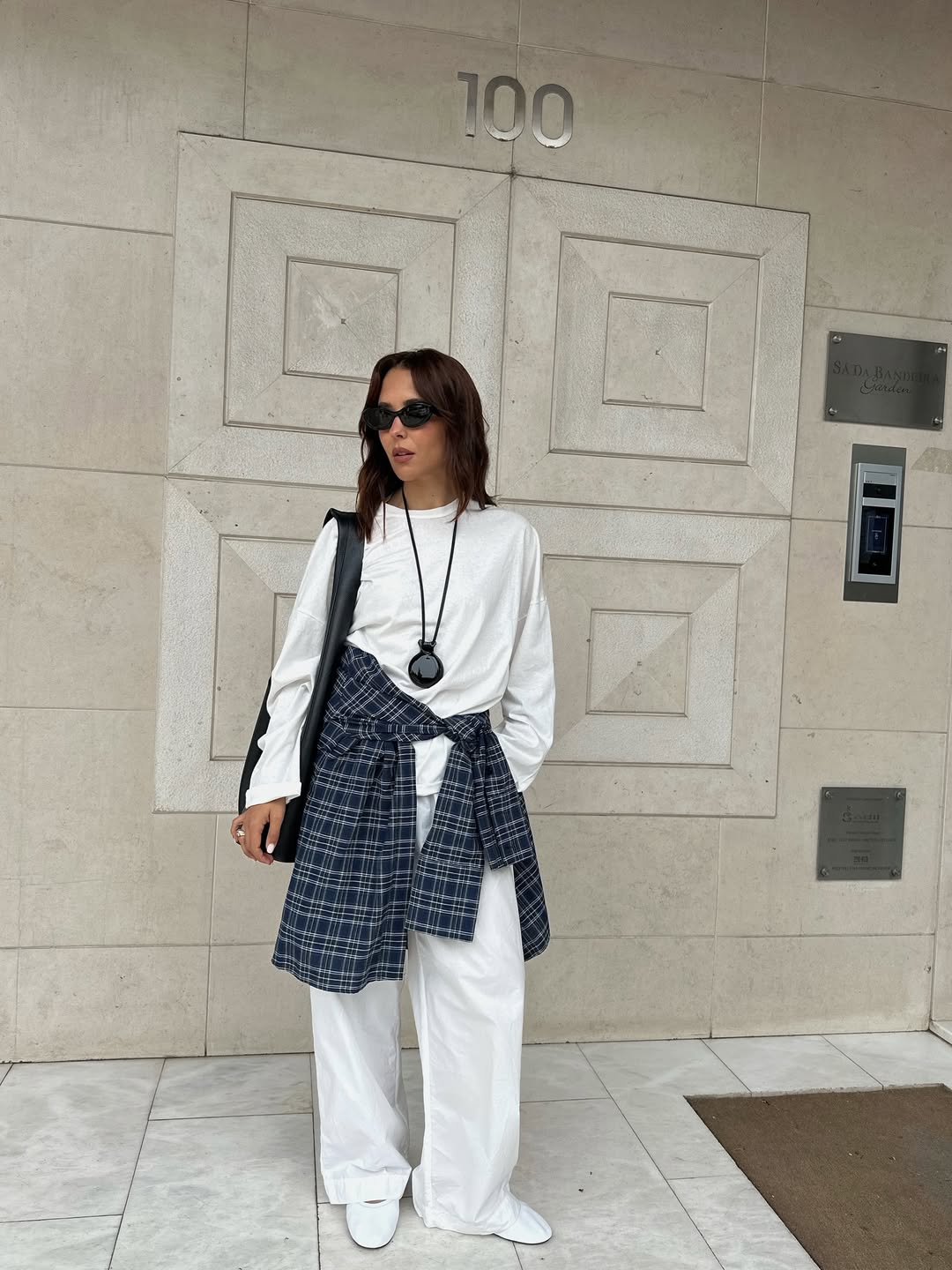 Debora Rosa wearing a plaid shirt