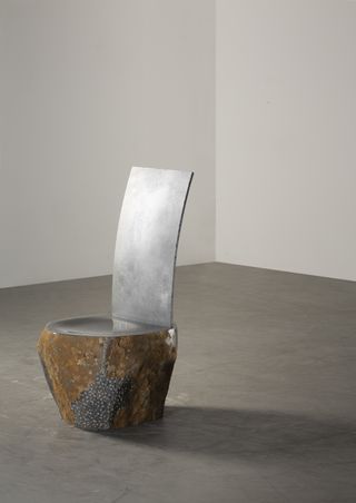 Wonmin Park chair made with a stone base and steel back