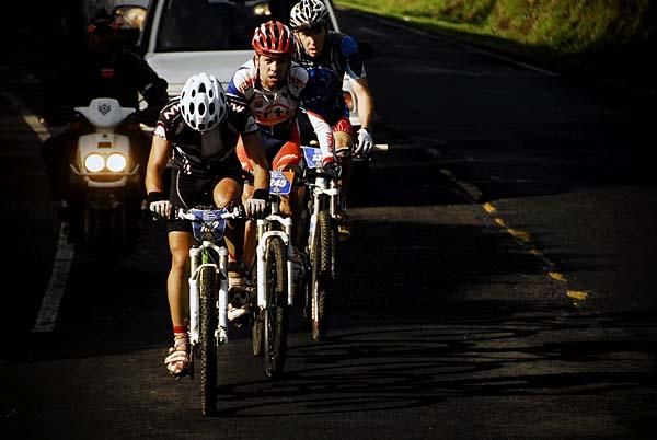 A trio of riders works each other over.