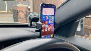 iOttie Easy One Touch 5 Smartphone Car Mount holding an iPhone in a car interior