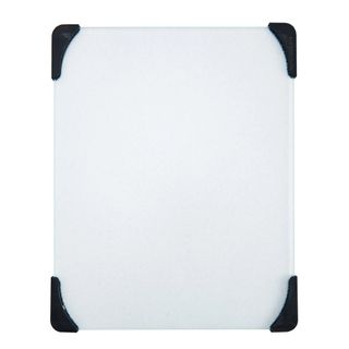 A glass cutting board with black non-slip corners