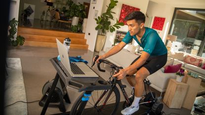 Male cyclist completing an indoor cycling workout