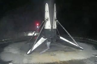 A SpaceX Falcon 9 rocket's first stage is seen after landing on the droneship "A Shortfall of Gravitas" in the Atlantic Ocean after launching 23 Starlink satellites on Wednesday, Nov. 22, 2023.