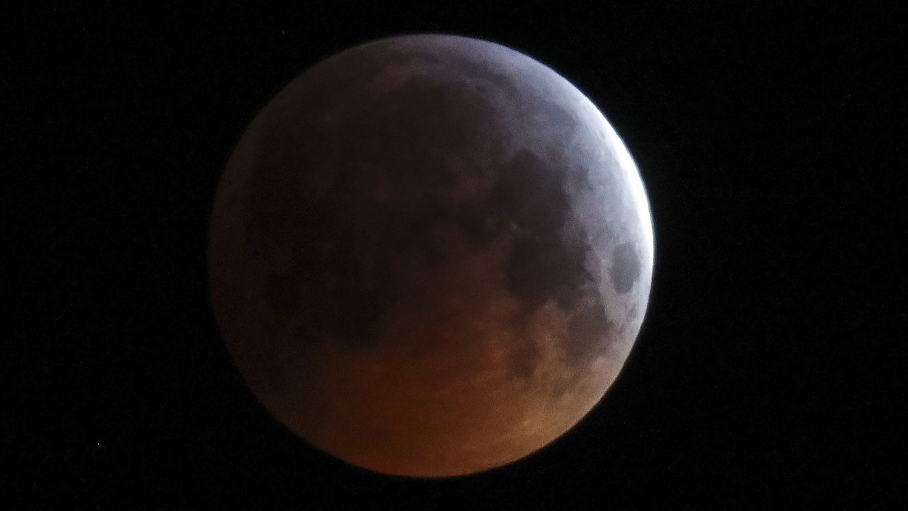 lunar eclipse over the village of Turets