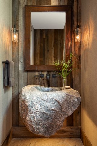 powder room with basin made of rough stone