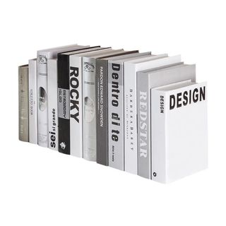 row of white decorative books in different sizes