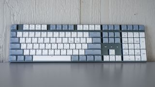 The full-size Satechi SM3 mechanical keyboard seen from straight ahead on top of a table