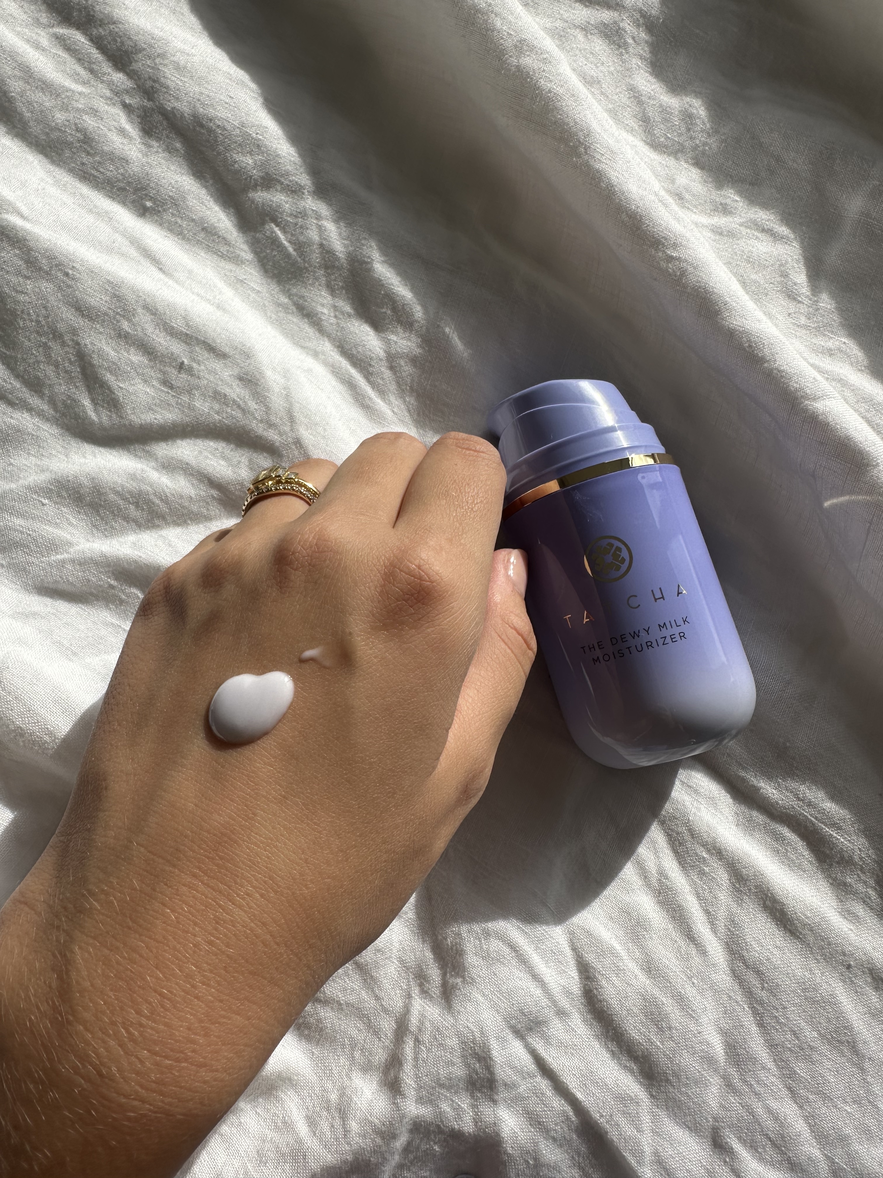 Shannon Lawlor with a swatch of Tatcha Dewy Milk Moisturizer on her hand